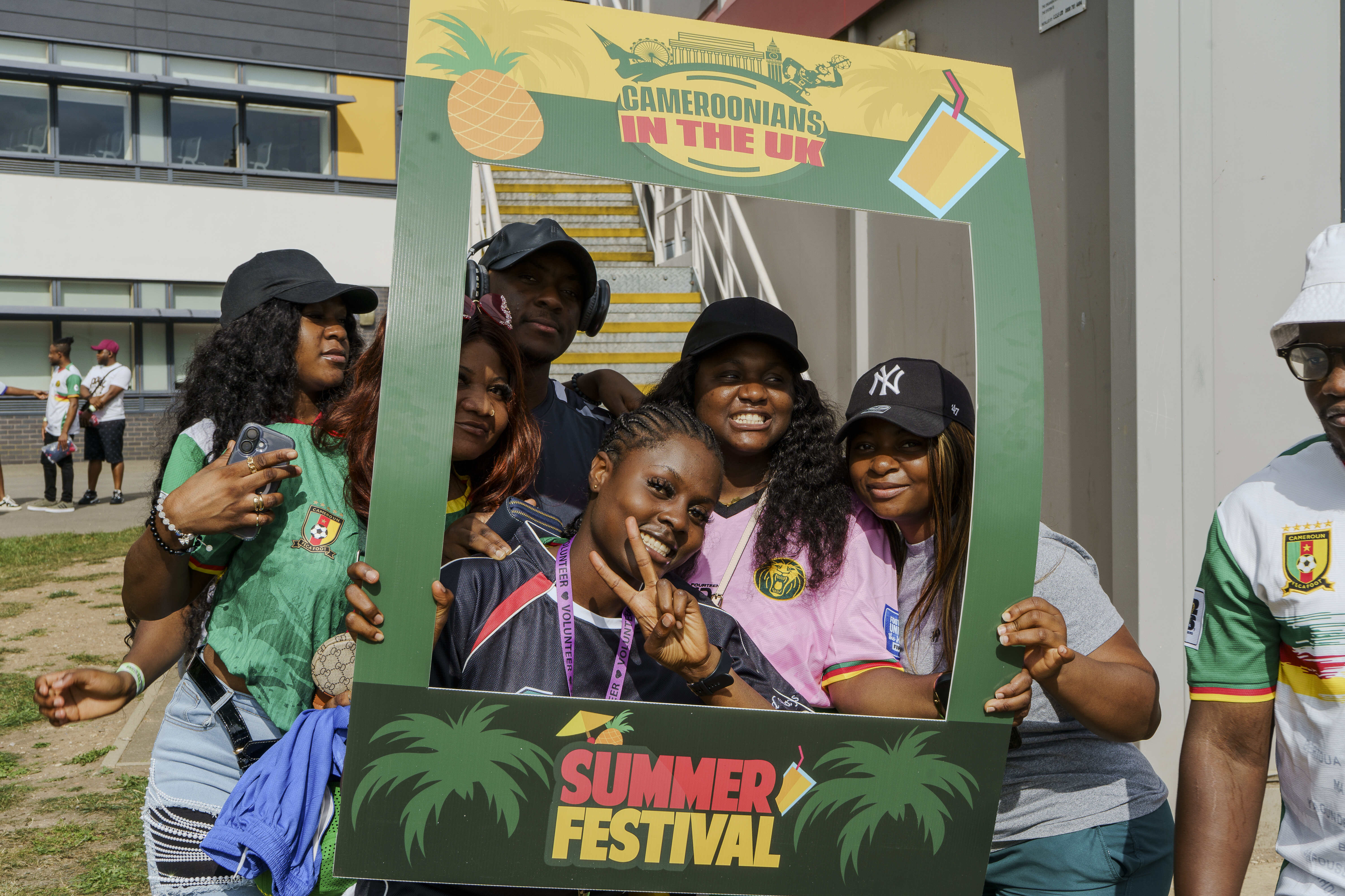 CAMUK members posing inside a Summer Festival photo frame