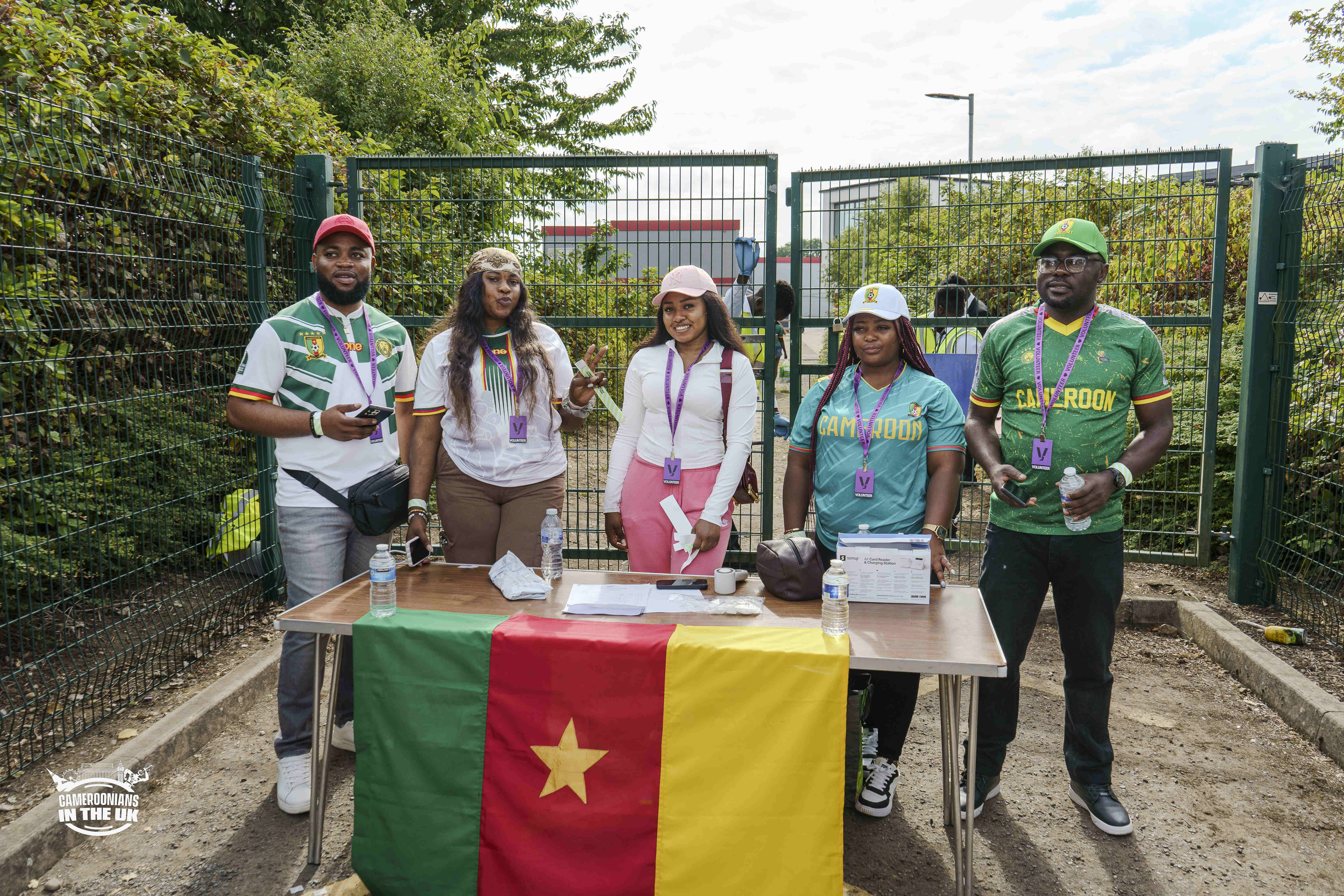 CAMUK members at a community event with the Cameroonian flag